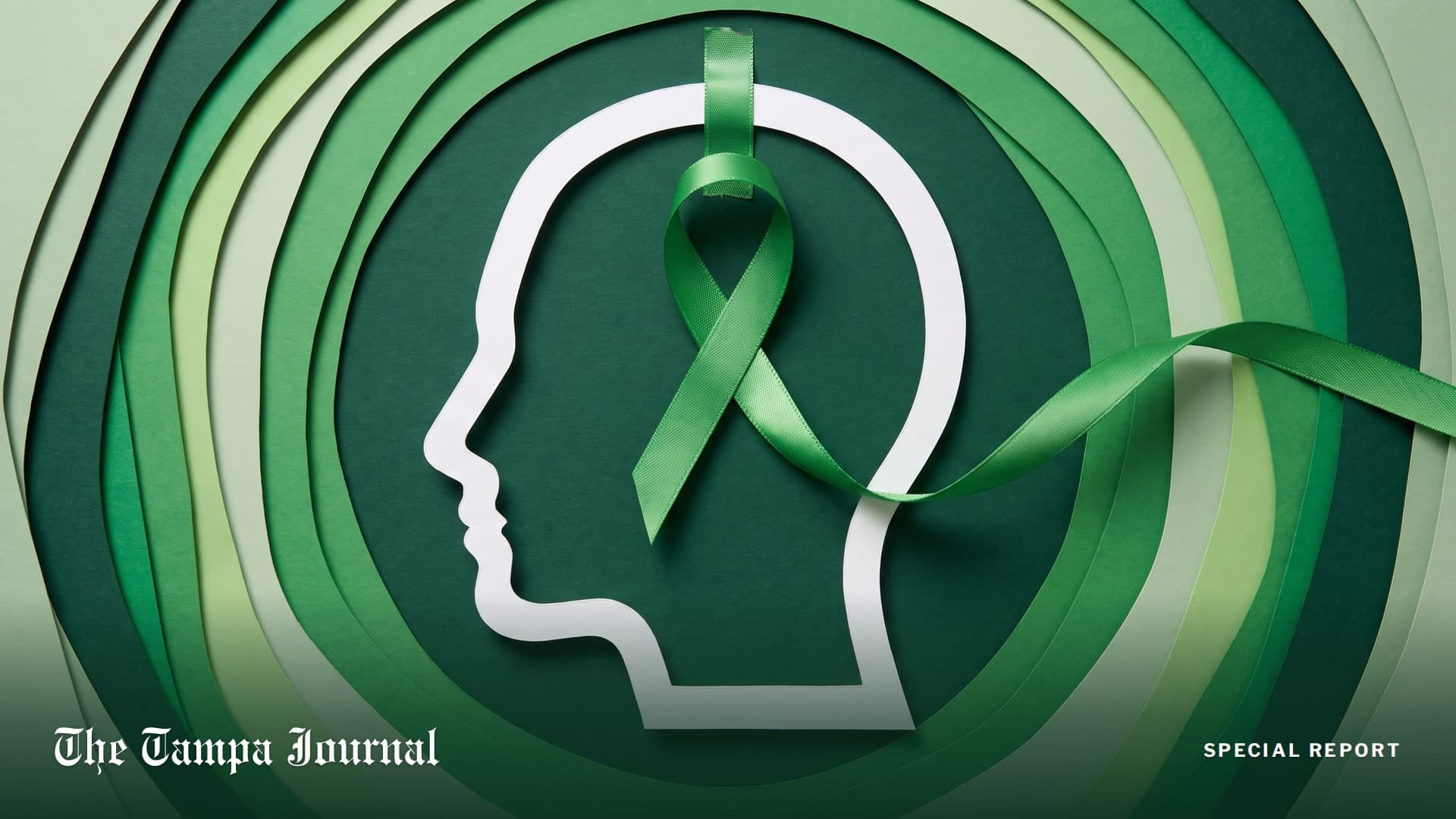 Paper-cut illustration of a human head in profile with a green mental health awareness ribbon